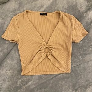 Very cute going out top. Tan, cropped, stretchy material